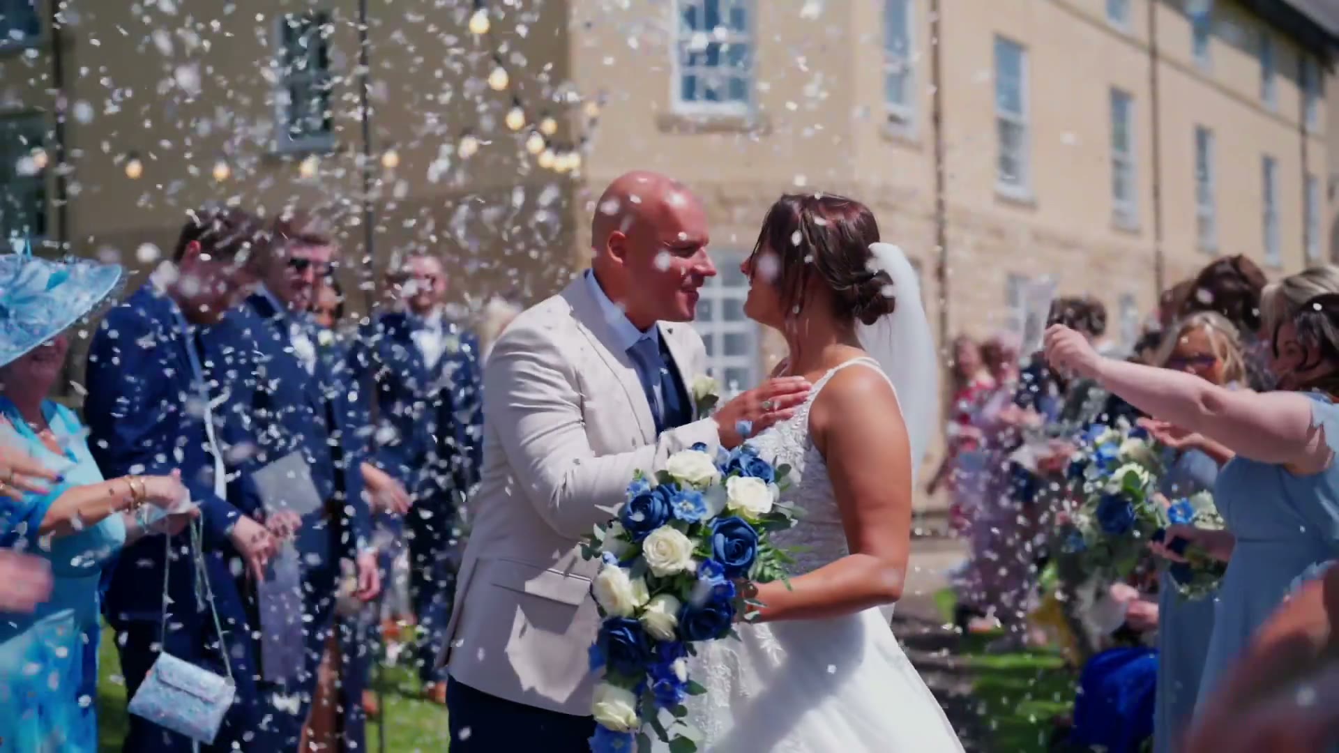 Confetti thrown over a couple as they walk out