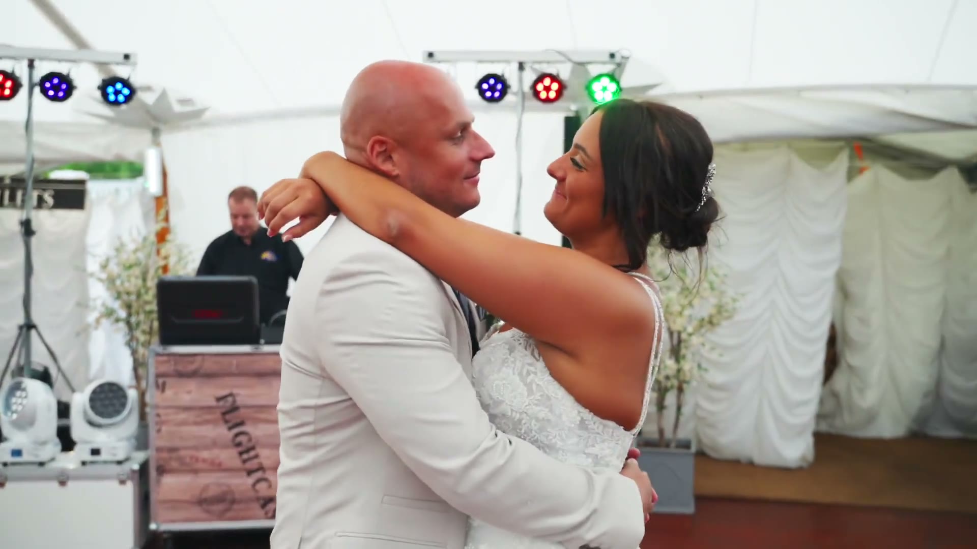 A couple embracing during their first dance