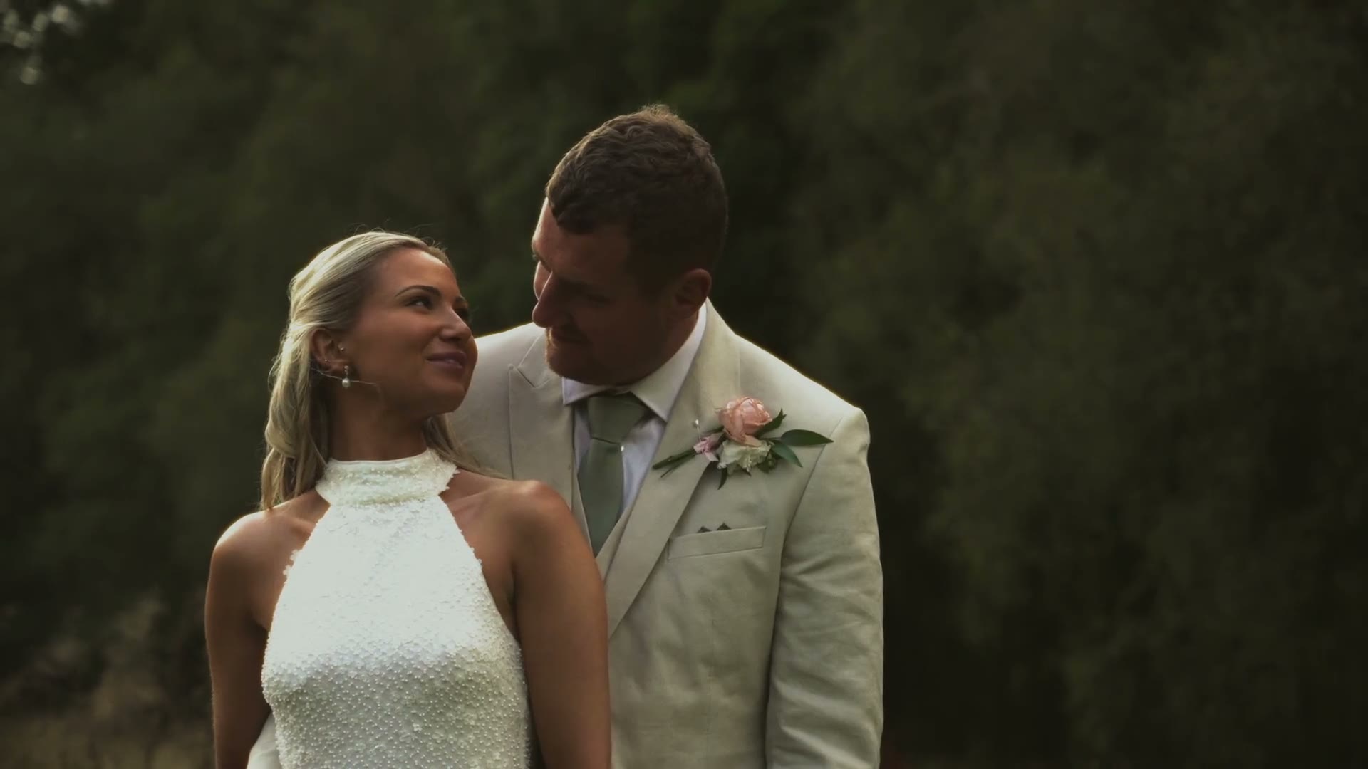 A bride and groom in golden evening light